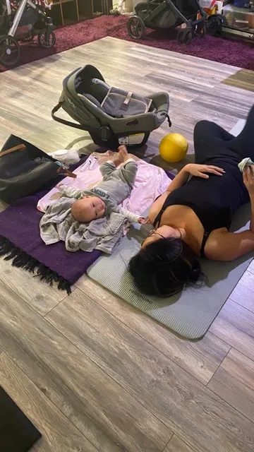 Caregiver and baby bonding during Baby & Me yoga at Owl's Head Yoga