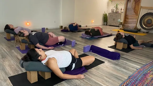 Prenatal yoga students resting in savasana at Owl's Head Yoga